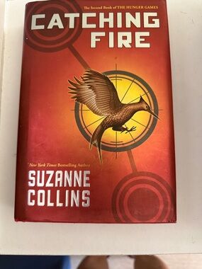 Catching Fire by Suzanne Collins - Red & Gold Hardcover